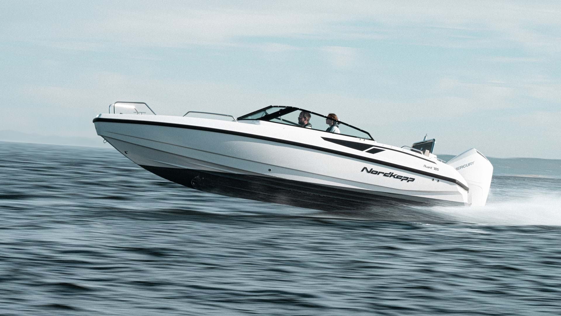 Bowrider anchored in a scenic cove for swimming